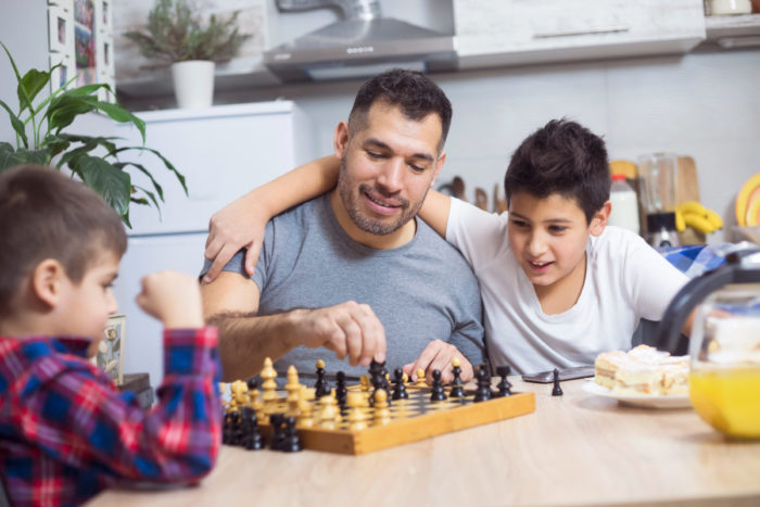 Father Playing Game With Sons